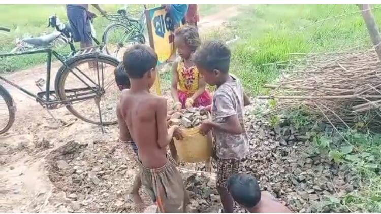 Children in Bhadrak, repaired a damaged village road