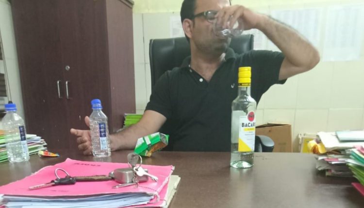 Probe Launched Into Viral Photo Showing Odisha RBSK Official Consuming Liquor In Office