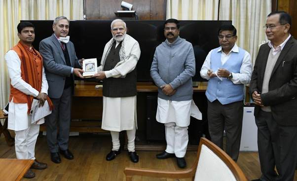 Pradhan presents  book titled India: The Mother of Democracy to the PM Modi